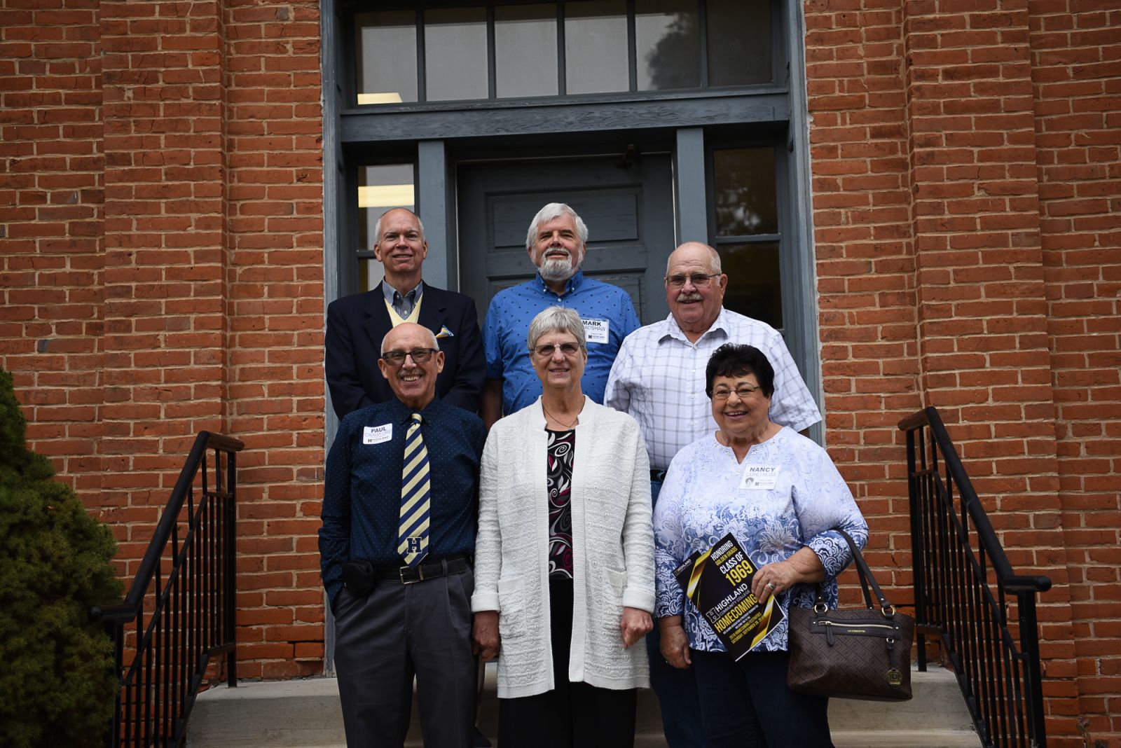 Members of the Golden Grad class of 1969, Mark Bradshaw (center back row) and Nancy (Juhl) Huss (bottom row at right) on a campus tour with Dr. Craig Mosher, retired Vice President of Institutional Advancement at HCC. 
