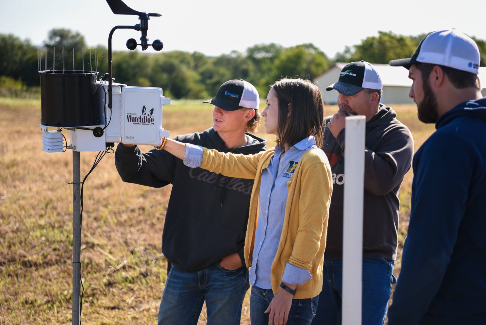Students working with equipment while in the field.