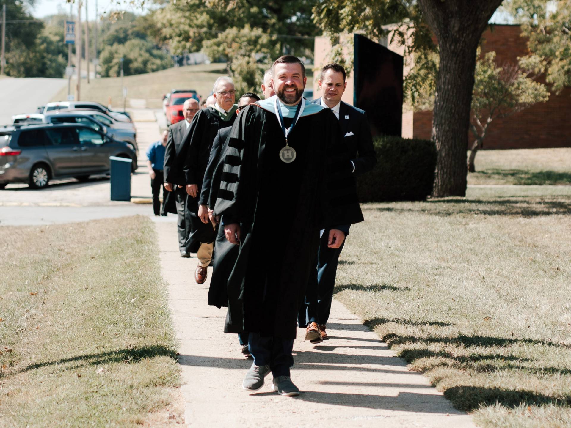 Graduation lineup lead by President Bowhay 
