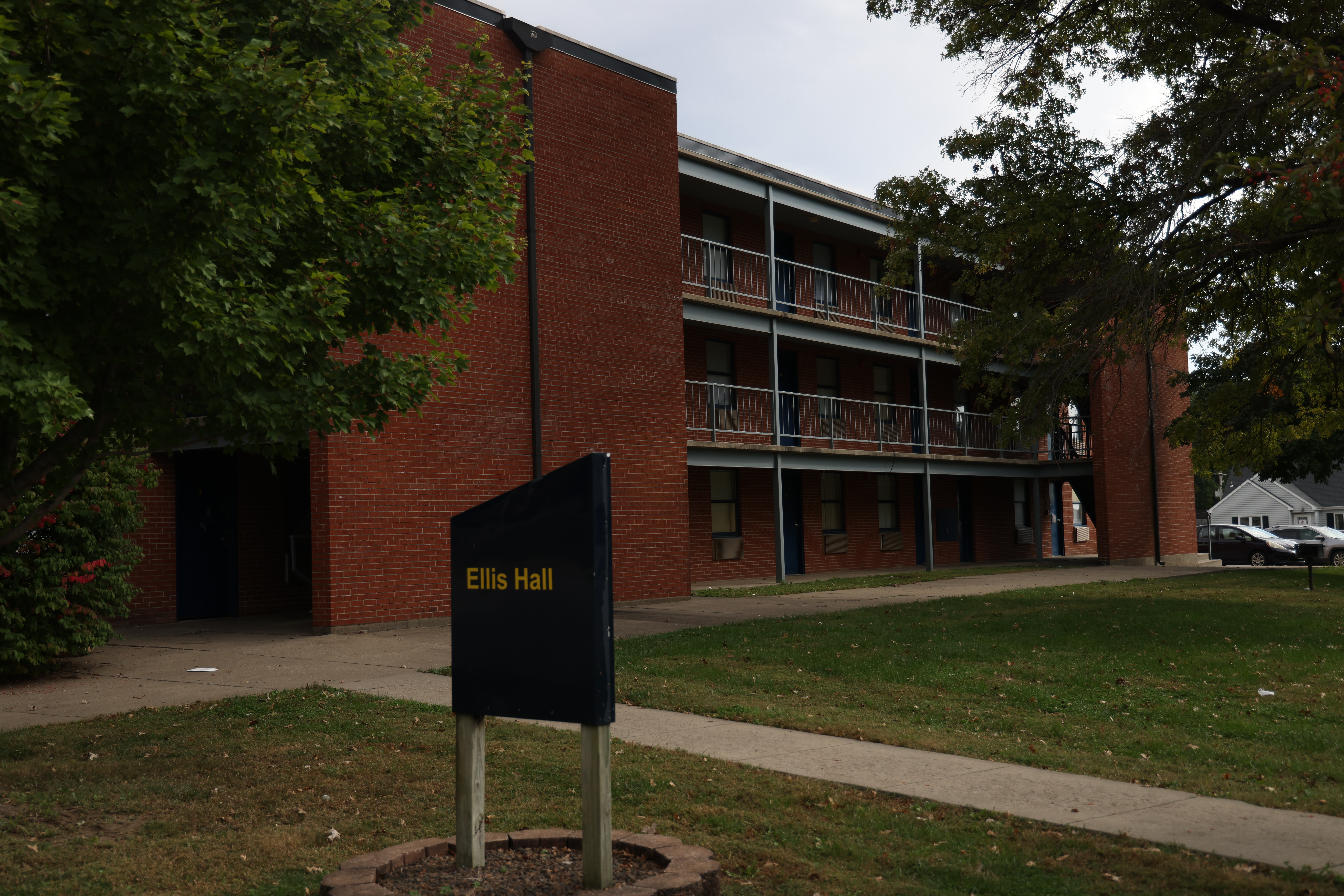 Outside view of the front of Ellis Hall, a two-story brick building.
