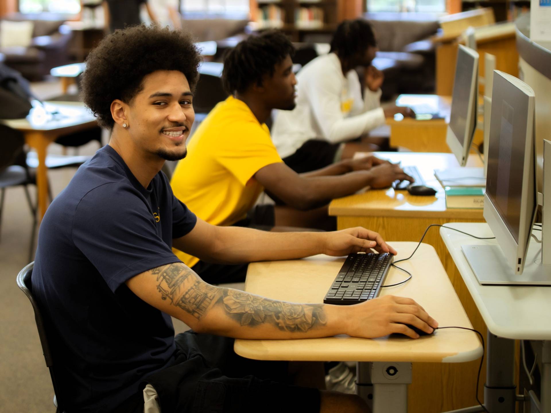 Student using a computer in the library