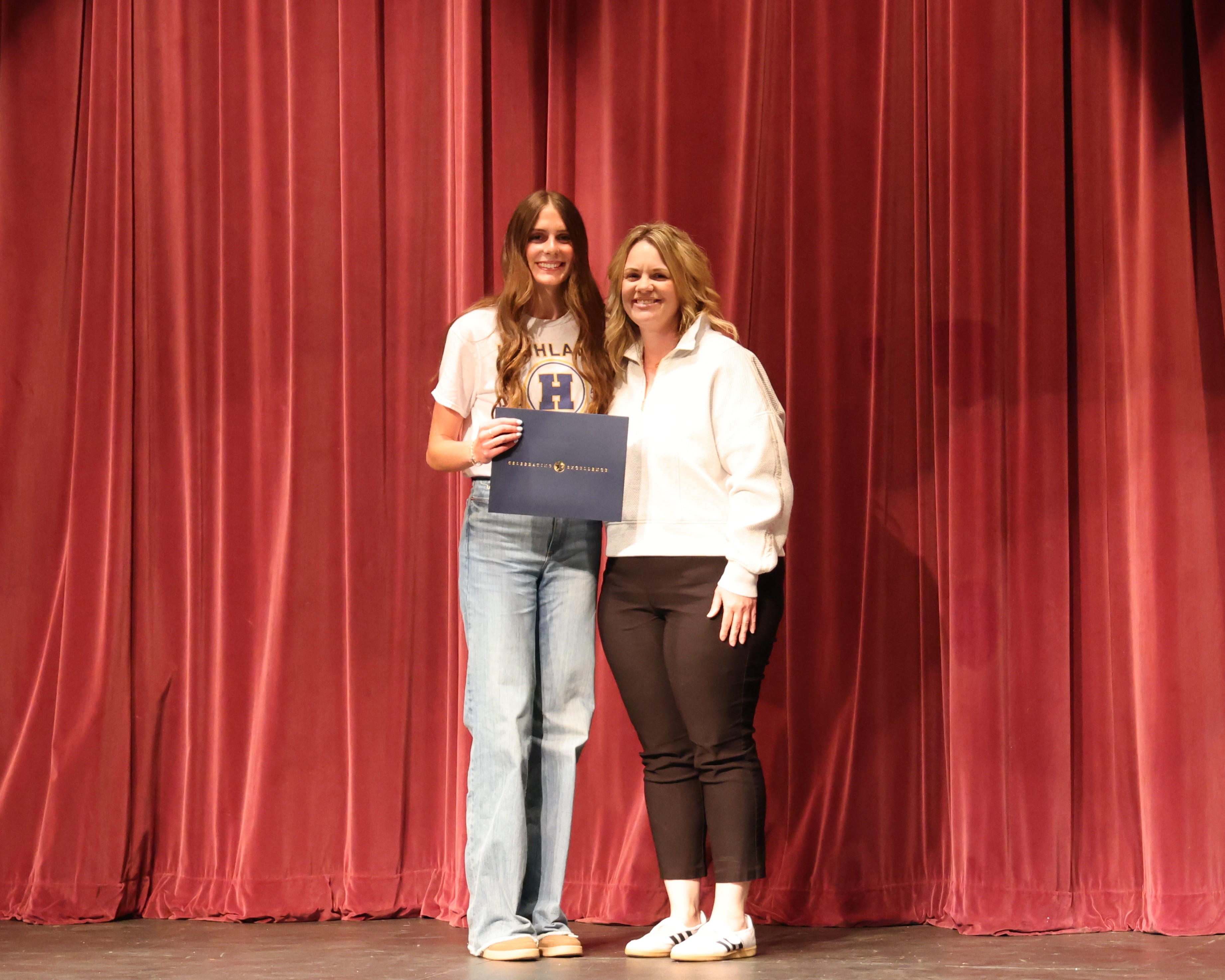 Athlete of the Year Award honors excellence in athletics and academics. Female recipient Cali Honeyman is presented award by Coach Andrea Keller