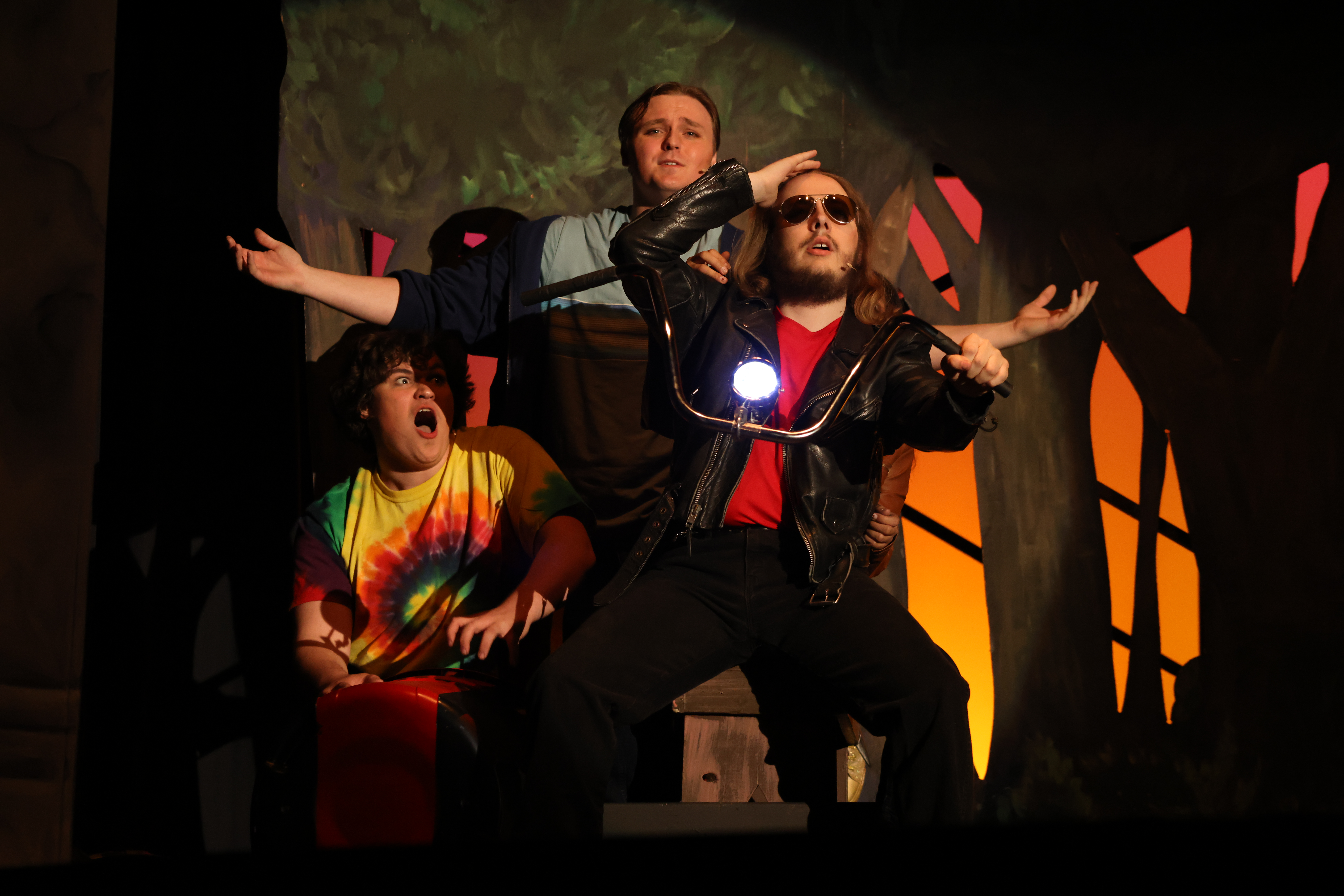 Three students performing Percy Jackson Lightning Theif